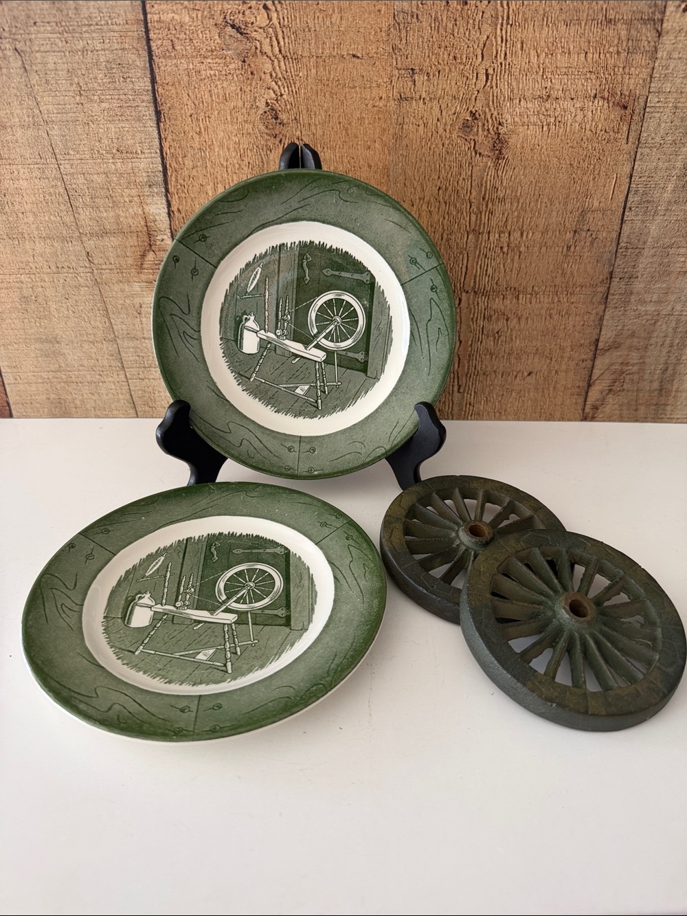 VTG cast iron wagon wheels and two vintage green Transferware plates